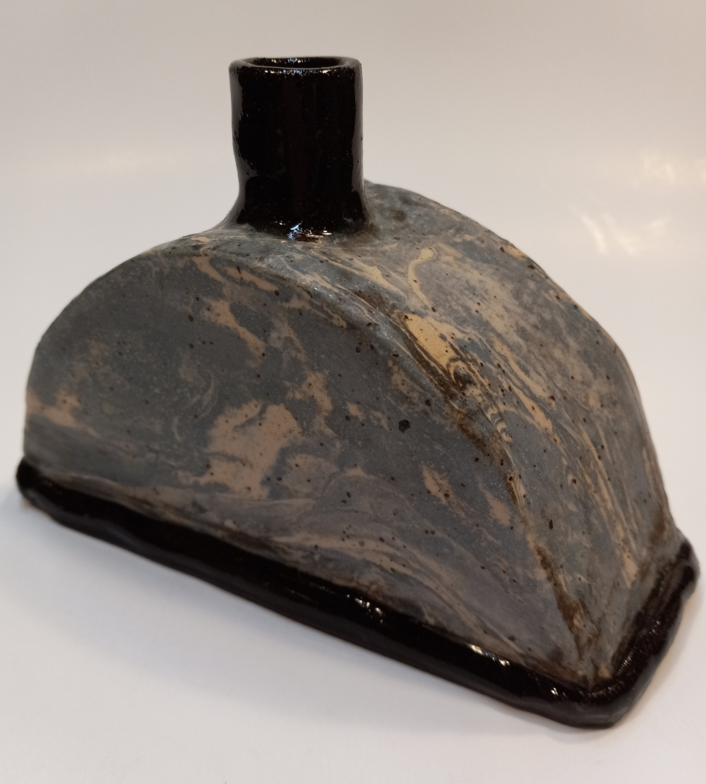 Vessel with mixed colour clay body in matte clear glaze, and black base and top. Decorative or can be used as container