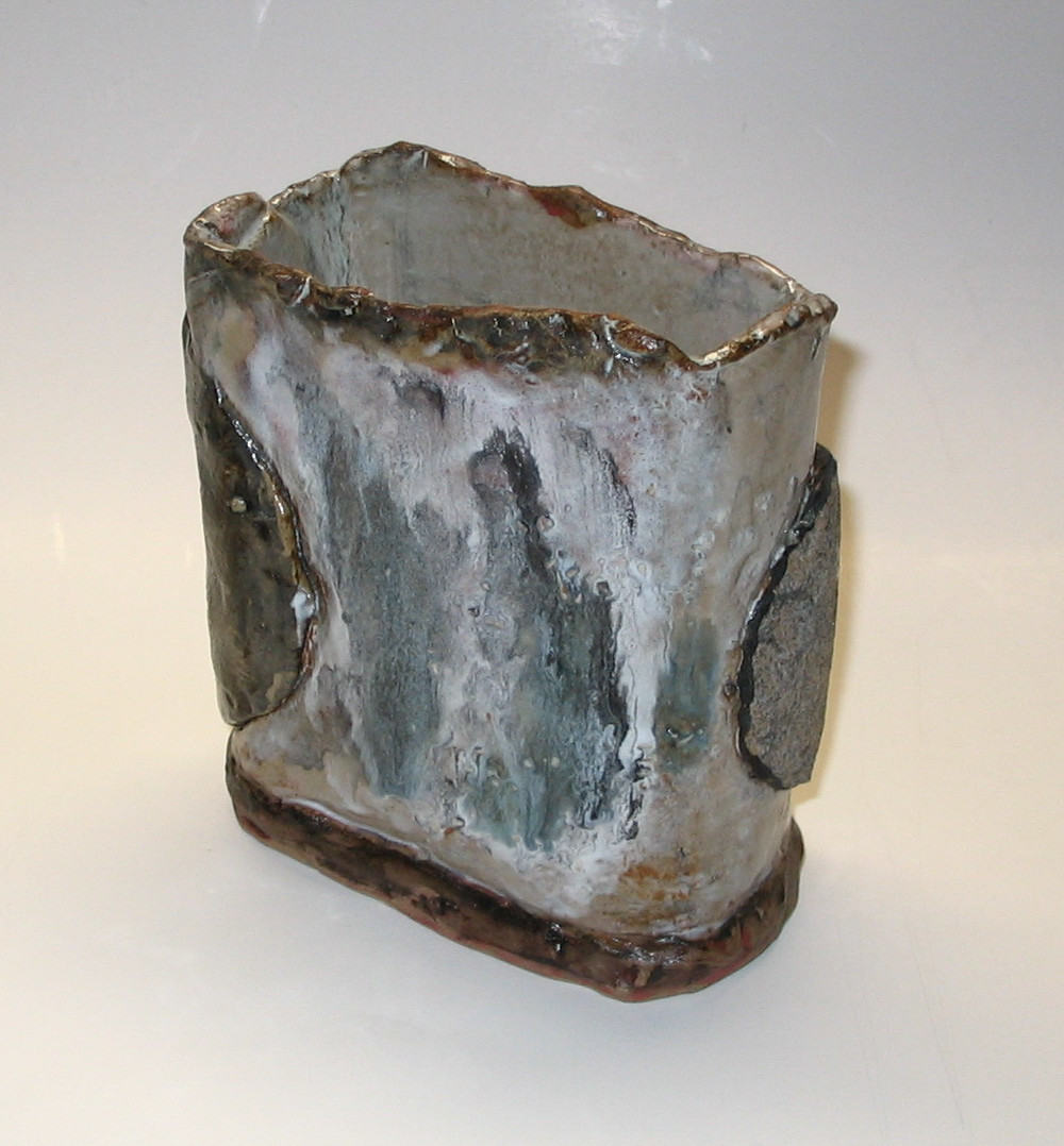 'Rain'  Oval shaped vessel in white clay with granite clay added circle, various glazes and slips.