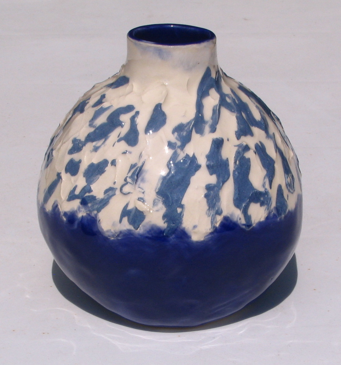 Blue/white mix on top and blue glaze underneath and interior