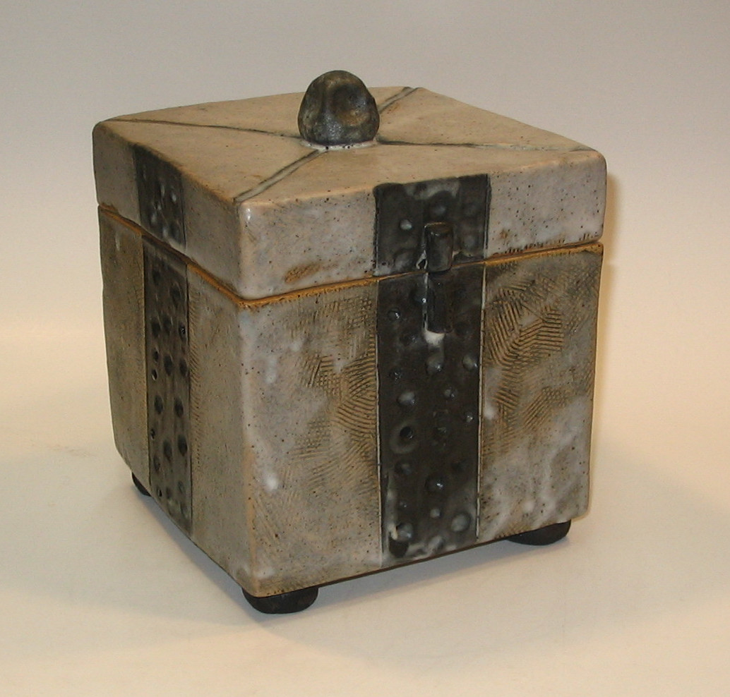 Brown/black box. Speckled clay with texture and matte clear glaze. Decorative or used as container. 10cm H x 10cm W